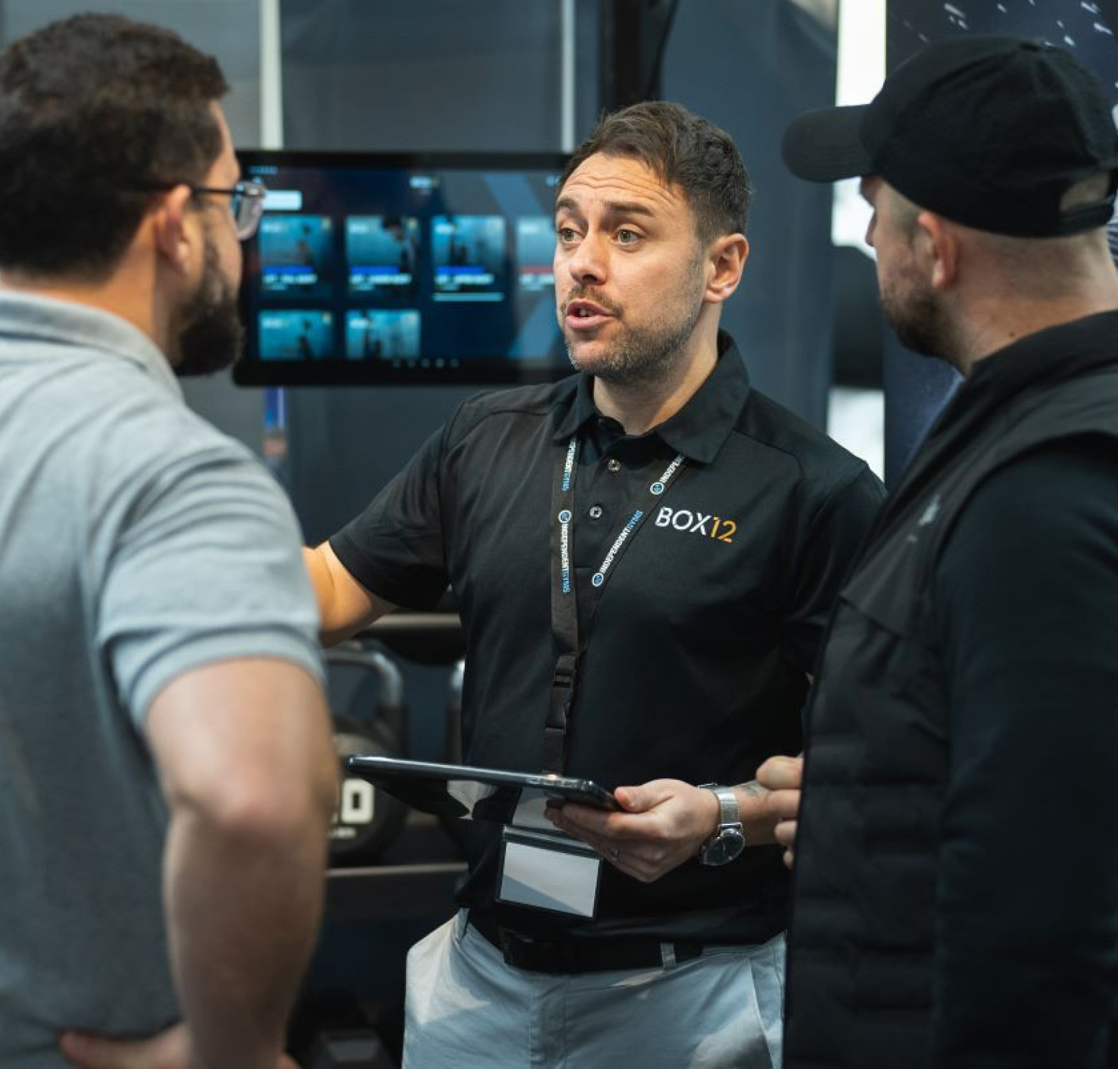 A man in a black polo shirt with 