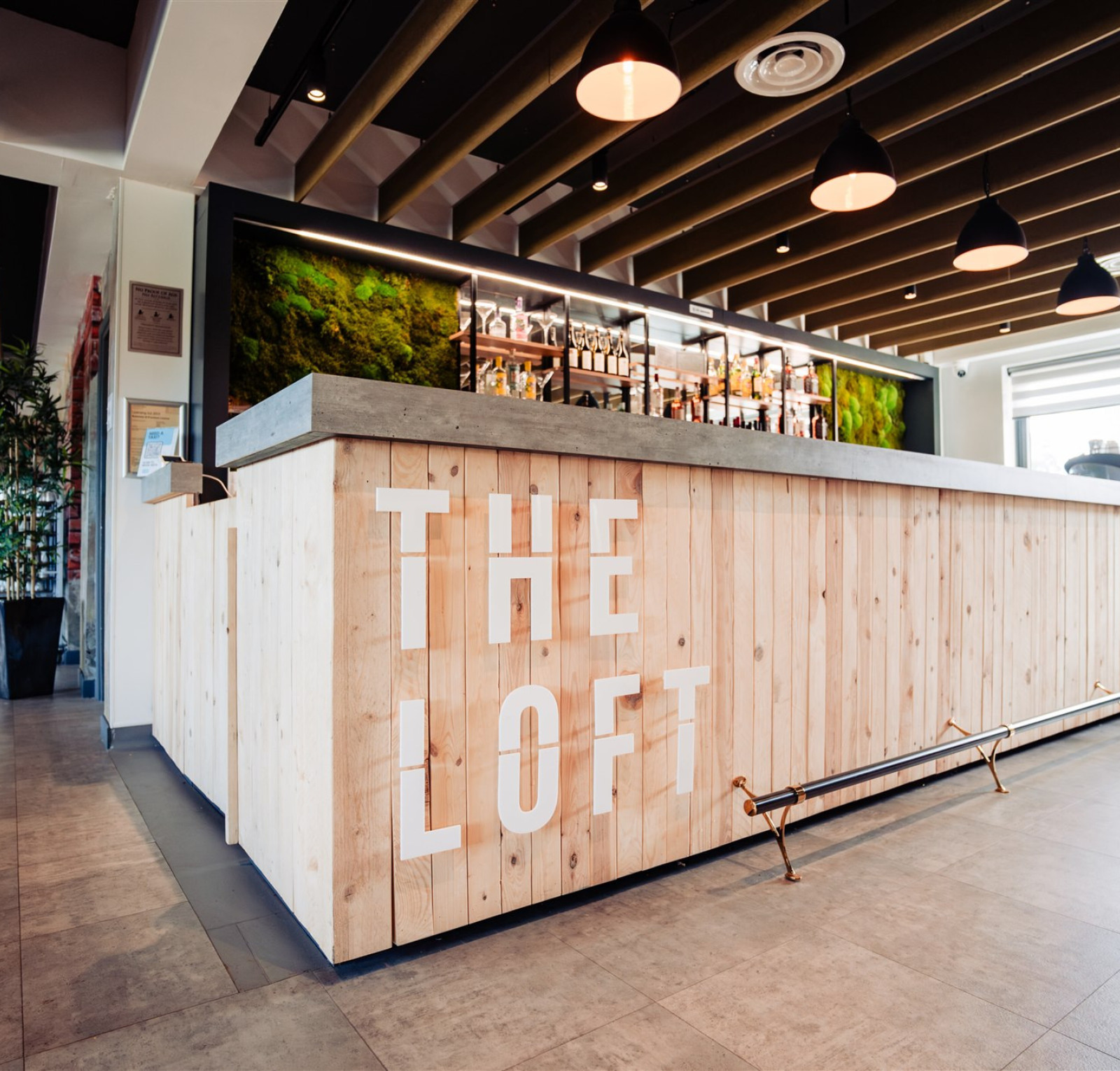 wooden bar stretching across room