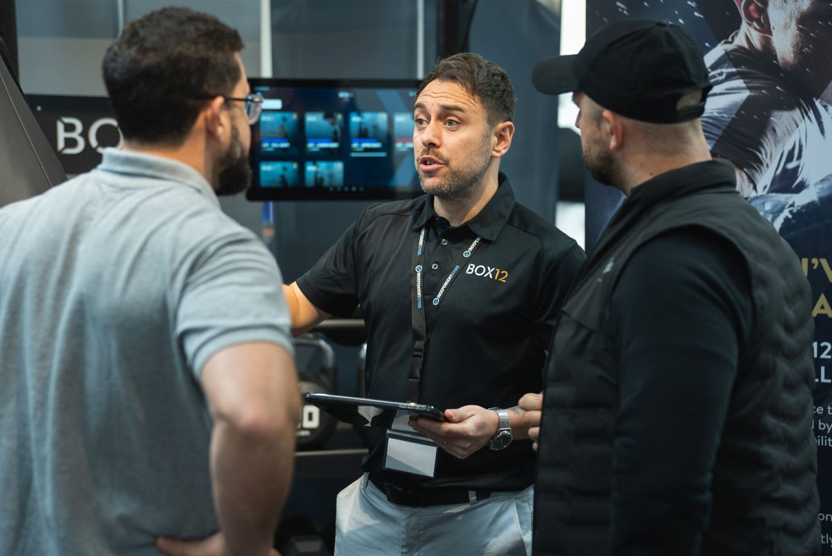 A man in a black polo shirt with 